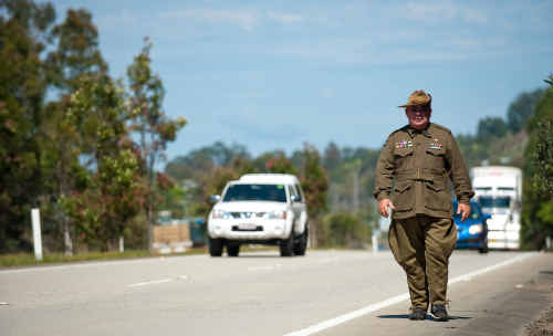 Striding out: Former serviceman Barry Gracey walking in a Diggers uniform on the outskirts of Coffs Harbour yesterday. Striding out: Former serviceman Barry Gracey walking in a Diggers uniform on the outskirts of Coffs Harbour yesterday.